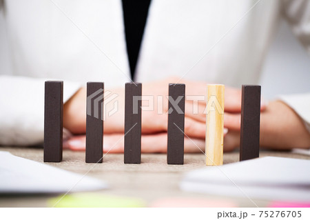 Beautiful young woman demonstrates on wooden bars business development concept 75276705