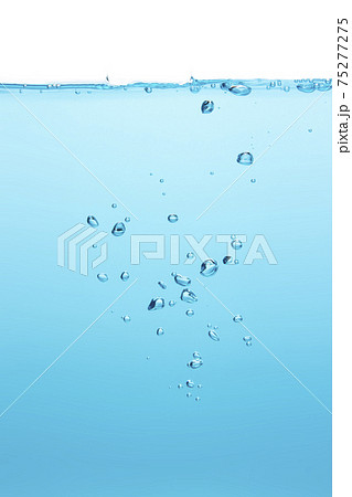Water waves make bubbles and splashes in the clear blue water. Bubbles in blue liquid Water waves make bubbles and splashes in the clear blue water. Bubbles in blue liquid 75277275