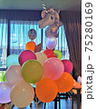 colorfull balloons with inflatable unicorn in the room 75280169