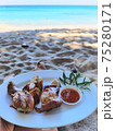 chicken legs with sweat spicy sause on the beach 75280171