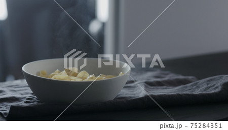 fettuccine in white bowl on linen cloth fettuccine in white bowl on linen cloth 75284351