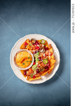 Nachos with ground beef, guacamole and cheese dip 75284923