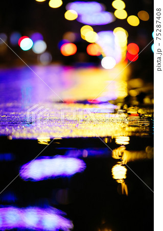 Beautiful night city lights and traffic lights, public transportation in night. Blurred background. Selective focus 75287408