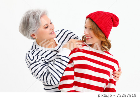 Loving daughter and mother in trendy outfits Loving daughter and mother in trendy outfits 75287819