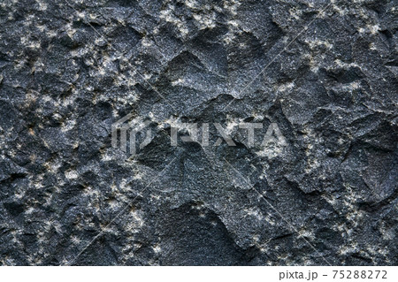 background, texture - the surface of a roughly hewn granite block 75288272