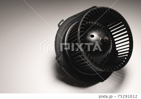 Heater motor. Spare part of car heating system on gray background 75291012