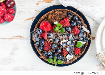 Homemade Chocolate Tart with Blueberries and Raspberries Homemade Chocolate Tart with Blueberries and Raspberries 75292632