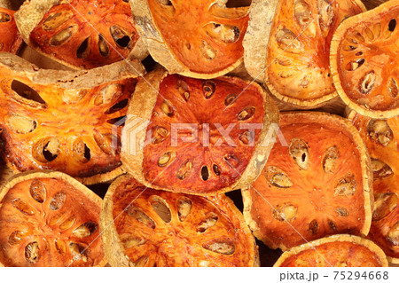Background of slices dried bael fruit. 75294668