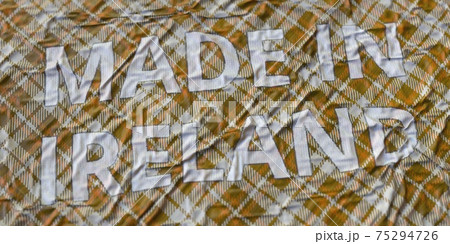 Textile with printed MADE IN IRELAND text, national fabric production concept, 3d rendering 75294726