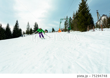 The young guy skis in the Carpathians is not very skillful. The young guy skis in the Carpathians is not very skillful. 75294748