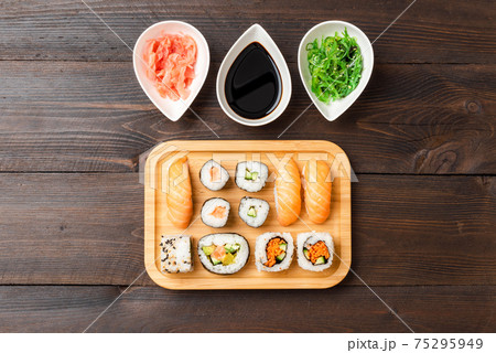 Japanese sushi with wasabi, ginger and algae salad Japanese sushi with wasabi, ginger and algae salad 75295949