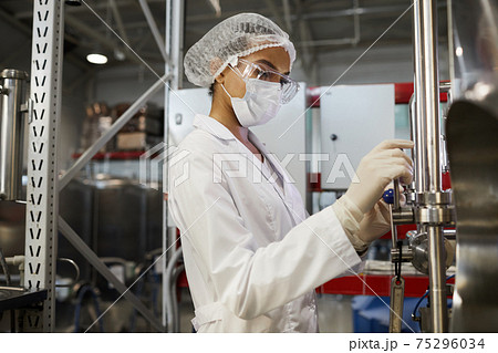 Female Worker at Chemical or Pharmaceutical Plant 75296034