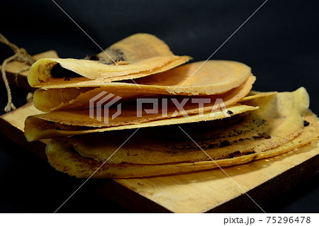 Indonesian Snacks, Leker cake. Its is thin, sweet, semicircular and delicious Indonesian Snacks, Leker cake. Its is thin, sweet, semicircular and delicious 75296478
