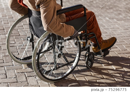 Wheelchair User Outdoors in City Wheelchair User Outdoors in City 75296775