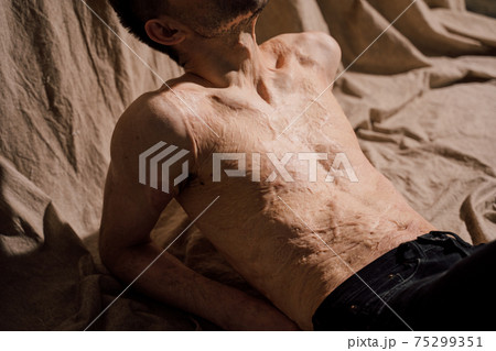 Man enjoying weekend lazy time alone at home, while daydreaming at fabric 75299351