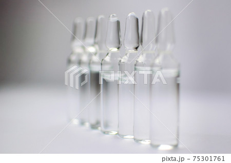 Medical ampoules for injection isolated on white background. Medicines and disease treatment, pharmacology and science concepts Medical ampoules for injection isolated on white background. Medicines and disease treatment, pharmacology and science concepts 75301761