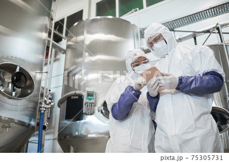 Two Workers Using Tablet at Chemical Plant 75305731