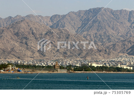 Jordan on the other side of the Gulf of Eilat. Photo taken from the side of Israel	 75305769