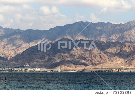 Jordan on the other side of the Gulf of Eilat. Photo taken from the side of Israel Jordan on the other side of the Gulf of Eilat. Photo taken from the side of Israel 75305898