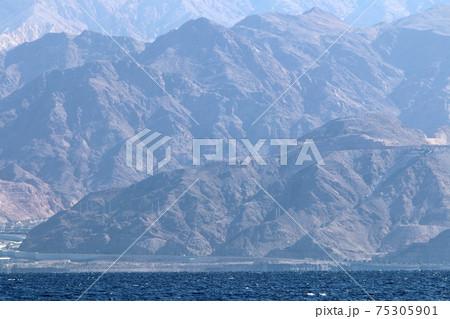 Jordan on the other side of the Gulf of Eilat. Photo taken from the side of Israel Jordan on the other side of the Gulf of Eilat. Photo taken from the side of Israel 75305901