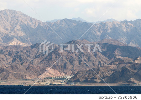 Jordan on the other side of the Gulf of Eilat. Photo taken from the side of Israel	 75305906