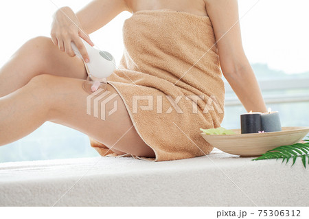 Woman getting LPG massage for skin care in home Woman getting LPG massage for skin care in home 75306312