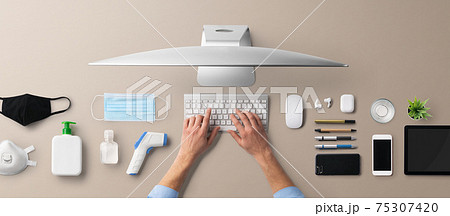 Flat lay top view desk working space with computer, business, home office and coronavirus concept. 75307420