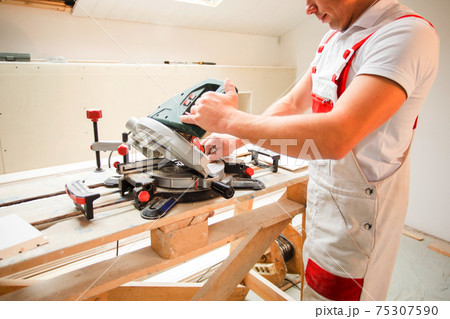 the master works with a special tool is processing boards the master works with a special tool is processing boards 75307590