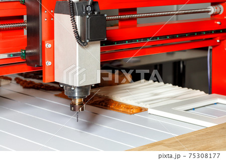 The electric spindle with a drill is installed on an automatic machine for processing wood, aluminum and plastics. The electric spindle with a drill is installed on an automatic machine for processing wood, aluminum and plastics. 75308177