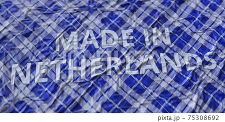 MADE IN NETHERLANDS text printed on a fabric, national textile production conceptual 3d rendering MADE IN NETHERLANDS text printed on a fabric, national textile production conceptual 3d rendering 75308692