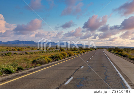 Road in the Mountains of view of multiple lane 75310498