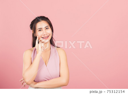 woman smiling standing chin handle relaxed thinking about something about the question woman smiling standing chin handle relaxed thinking about something about the question 75312154