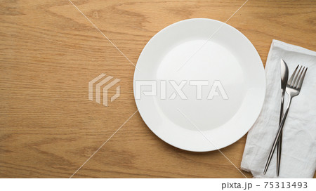 Table Setting Background, mock up ceramic plate, fork and table knife on white napkin, empty ceramic dish 75313493