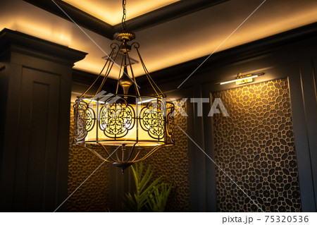 metal lamp in oriental style on the ceiling of the interior metal lamp in oriental style on the ceiling of the interior 75320536