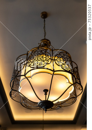 metal lamp in oriental style on the ceiling of the interior metal lamp in oriental style on the ceiling of the interior 75320537