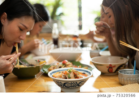 A Bowl of Tomyum Spicy noodle soup with blur background 75320566