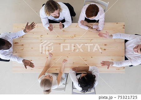Business team working at meeting table Business team working at meeting table 75321725