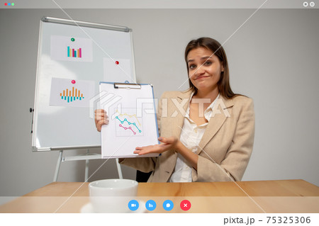 Young woman talking, working in videoconference with co-workers at office or living room. Online business, education during quarantine. 75325306