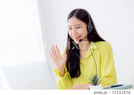 Young asian business woman using laptop computer for video conference online with social distancing. Young asian business woman using laptop computer for video conference online with social distancing. 75331076