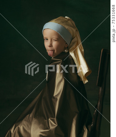 Medieval little girl as a lady with a pearl earring on dark studio background. Concept of comparison of eras, childhood. Stylish creative design, art vision, new look of artwork. 75331668