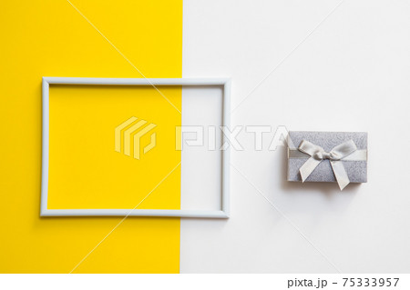 Empty photo frame for text on geometric paper white and yellow colorful background. 75333957