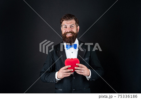 happy tuxedo man with heart. happy valentines day. be  75336186