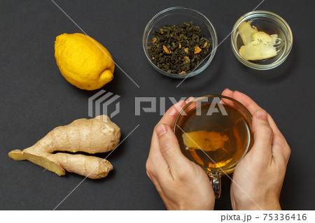 Health remedy foods for cold and flu relief on a black background. Health remedy foods for cold and flu relief on a black background. 75336416