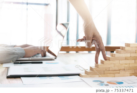 Success concept with business woman hand climbing wooden block stairs in  Business Concept 75337471