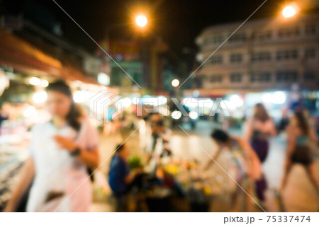 abstract blur image of food stall at night market festival for background usage 75337474