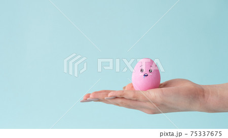 hunger charity egg drooling face on hand open palm 75337675