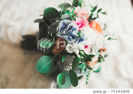 Wonderful luxury wedding bouquet of different flowers Wonderful luxury wedding bouquet of different flowers 75343800