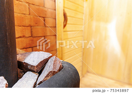 Interior details of traditional Finnish sauna steam room. Traditional old Russian bathhouse SPA Concept. Relax country village bath concept. 75343897