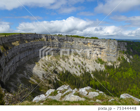 The famous rock arena of Creux du Van, the Swiss Grand Canyon. The famous rock arena of Creux du Van, the Swiss Grand Canyon. 75344448