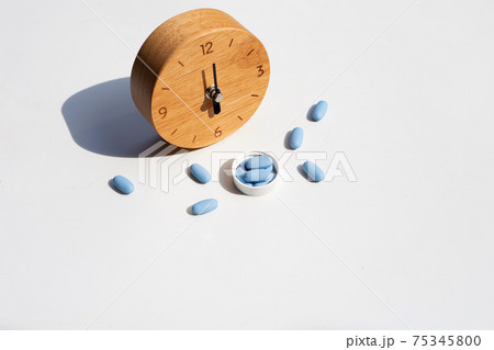 PrEP ( Pre-Exposure Prophylaxis) used to prevent HIV with wooden clock 75345800
